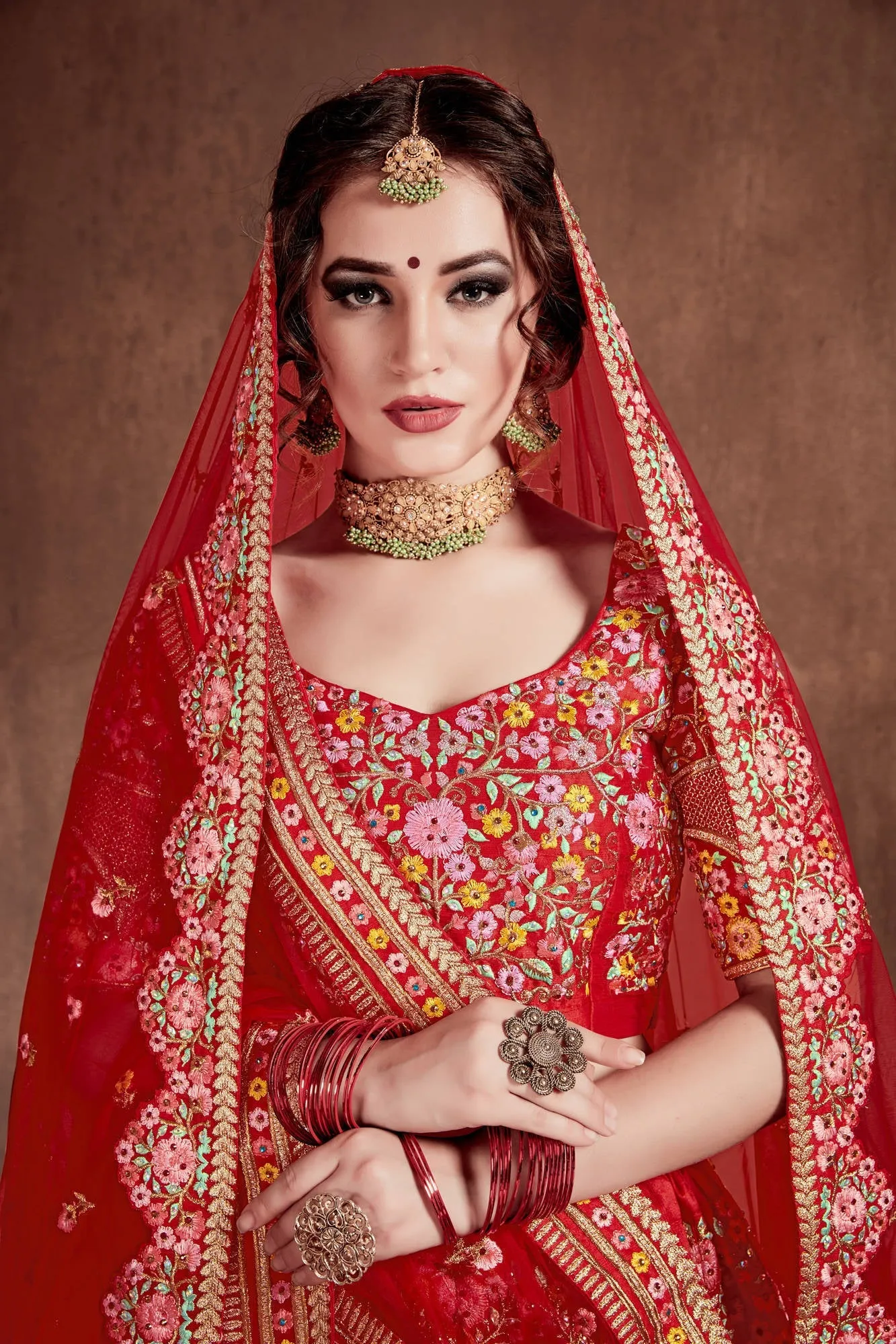 Flattering Red Colored Designer Bridal wear Embroidered Lehenga Choli